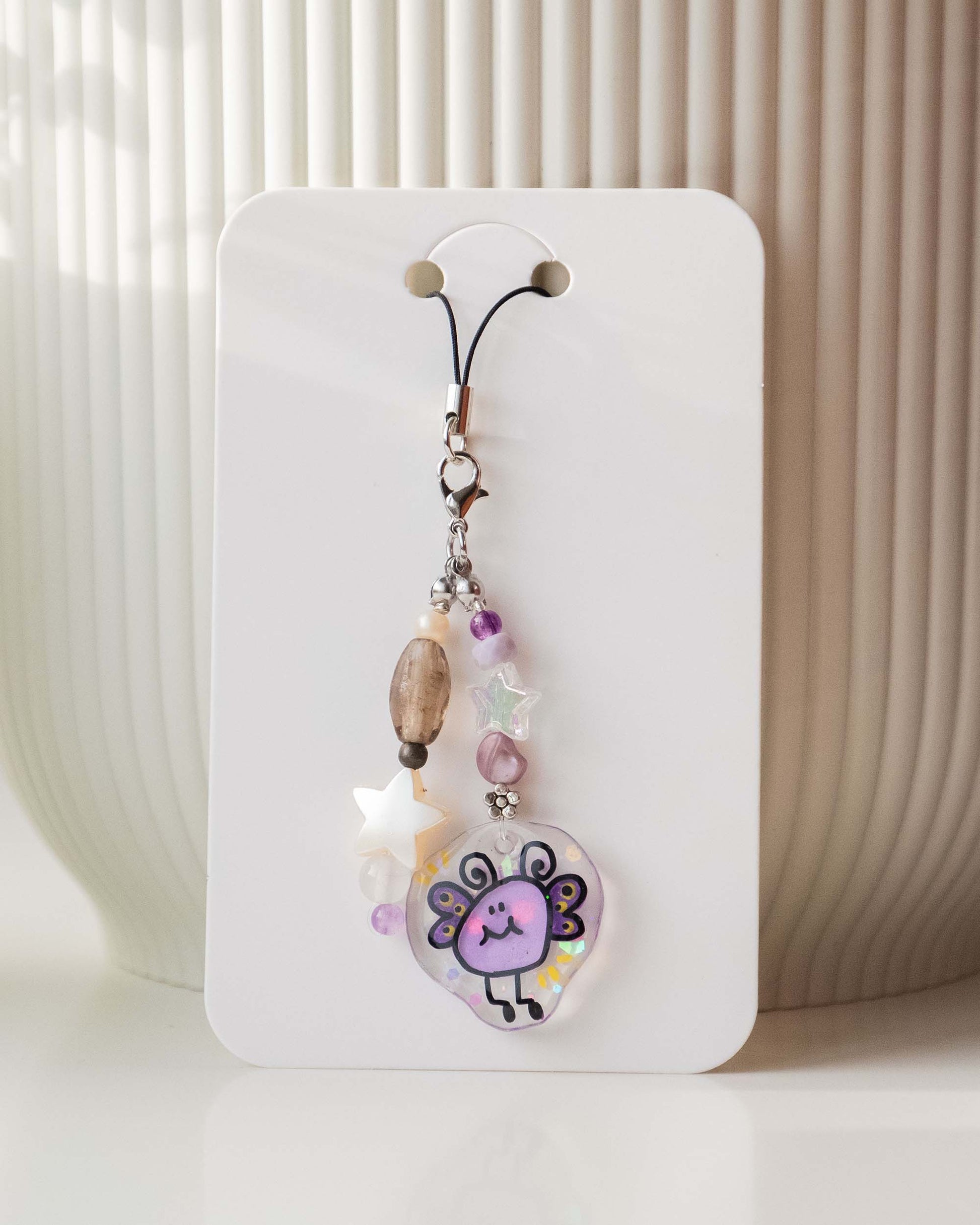 Butterfly blob phone charm star decoration sunny backdrop